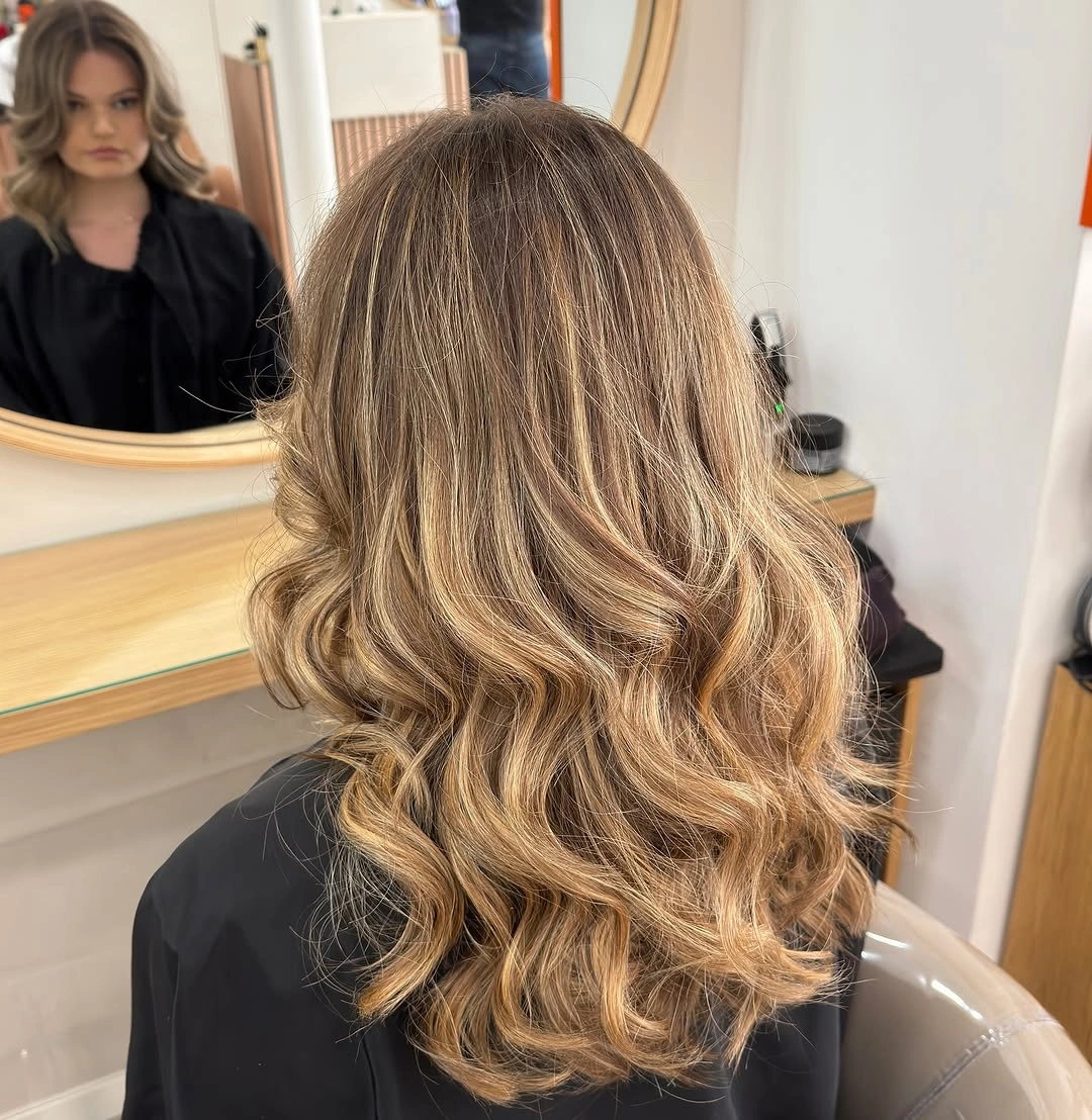 Medium-long bronde curls with beige and golden ribbons