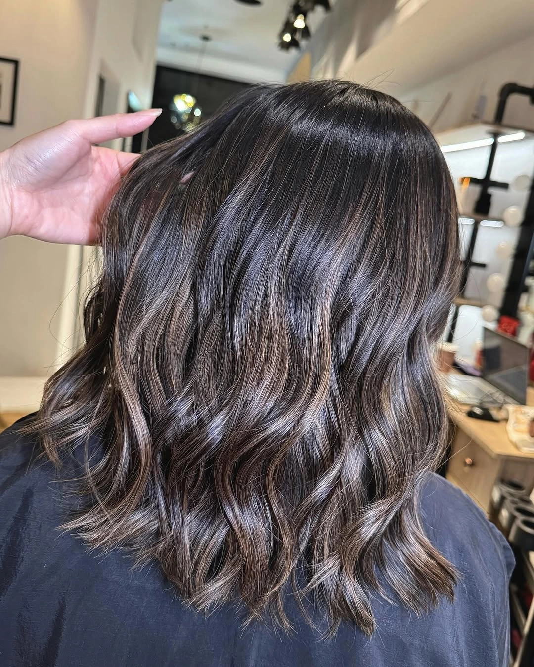 Shoulder-length brunette waves with cool beige and taupe ribbons