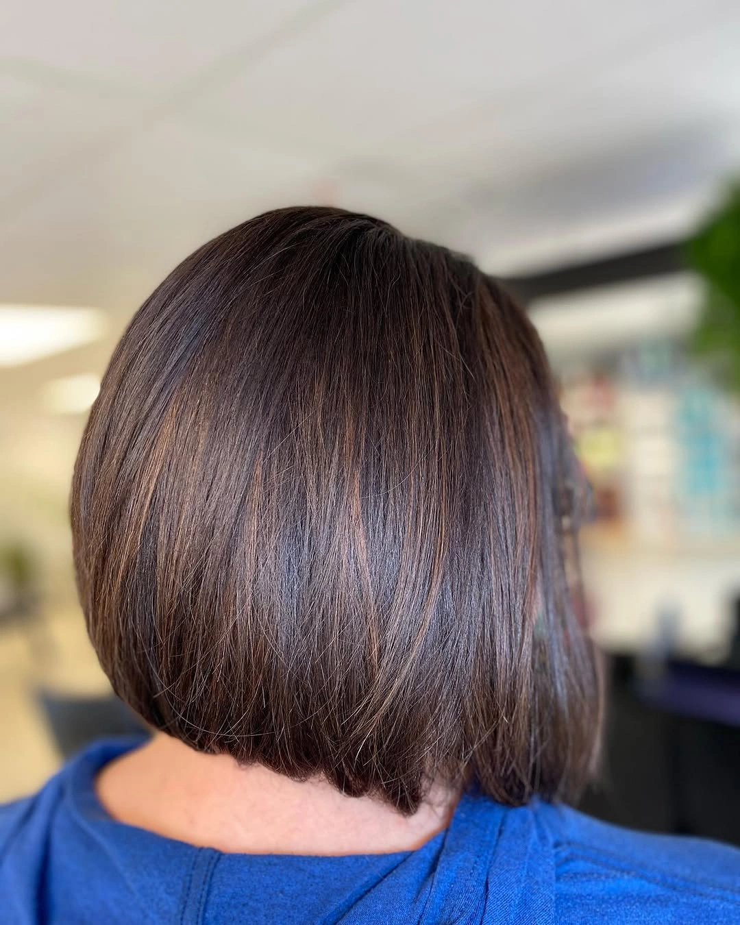 Short dark brown bob with smooth rounded nape edge