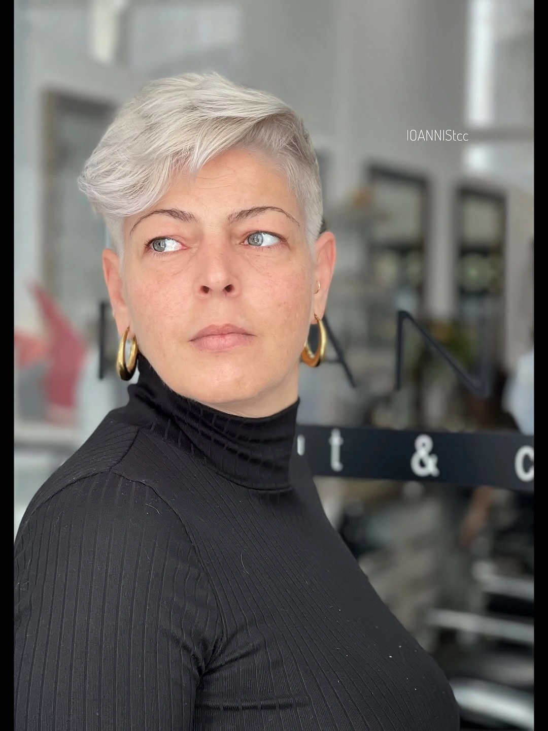 Short silver pixie with cropped sides and longer swept top