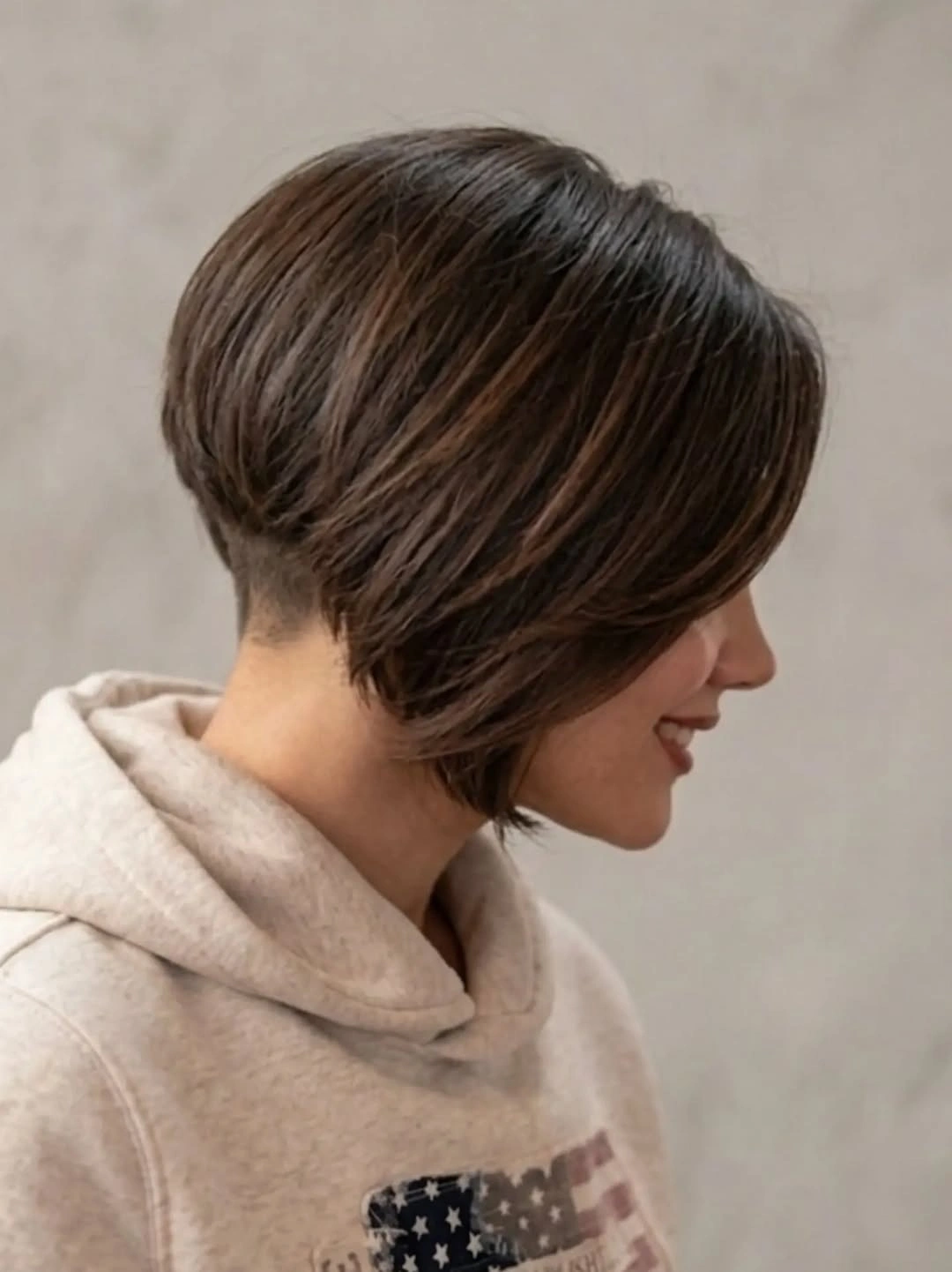 Short brown graduated bob with rounded back and long side fringe
