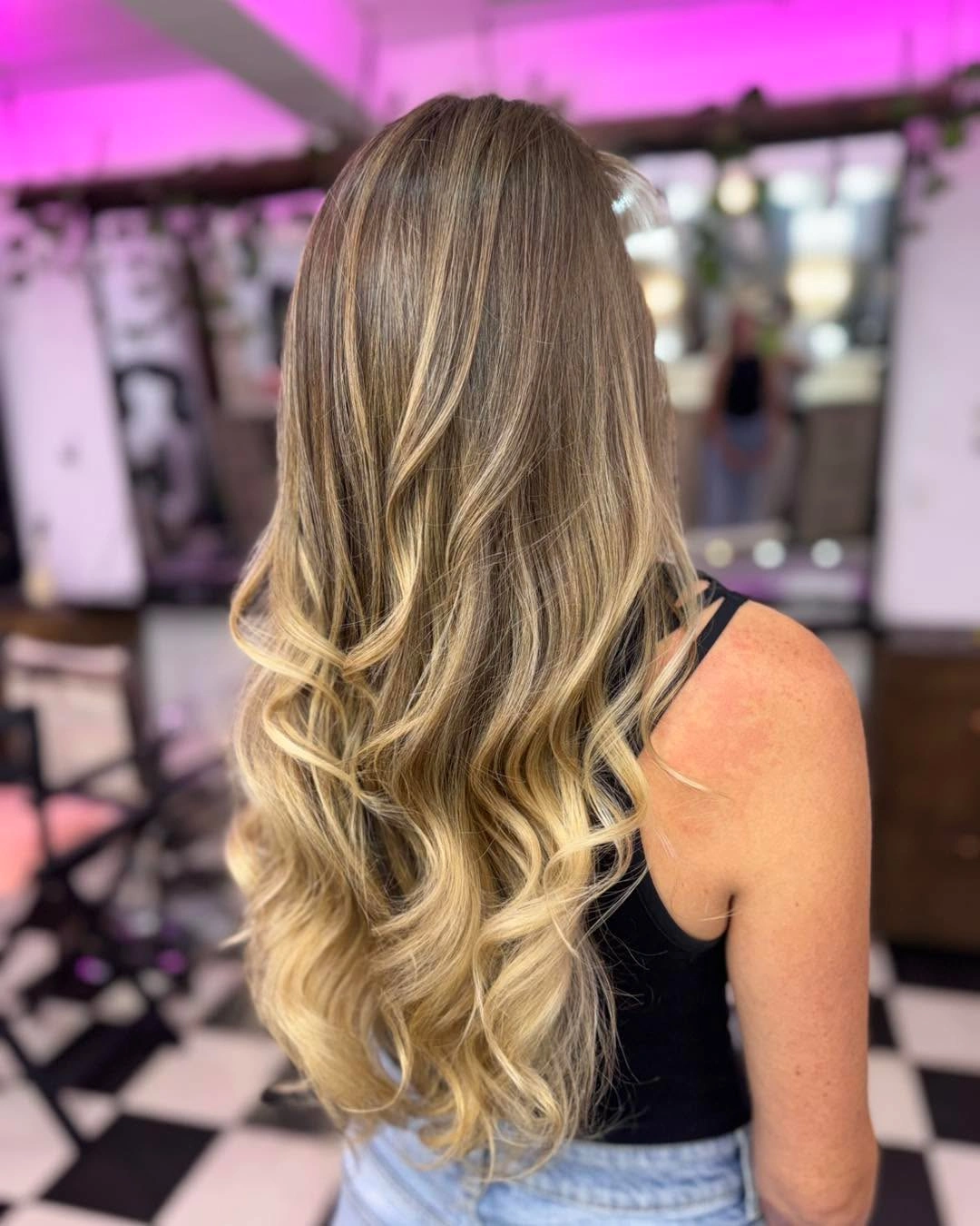 Long wavy hair with layered movement and softly tapered ends
