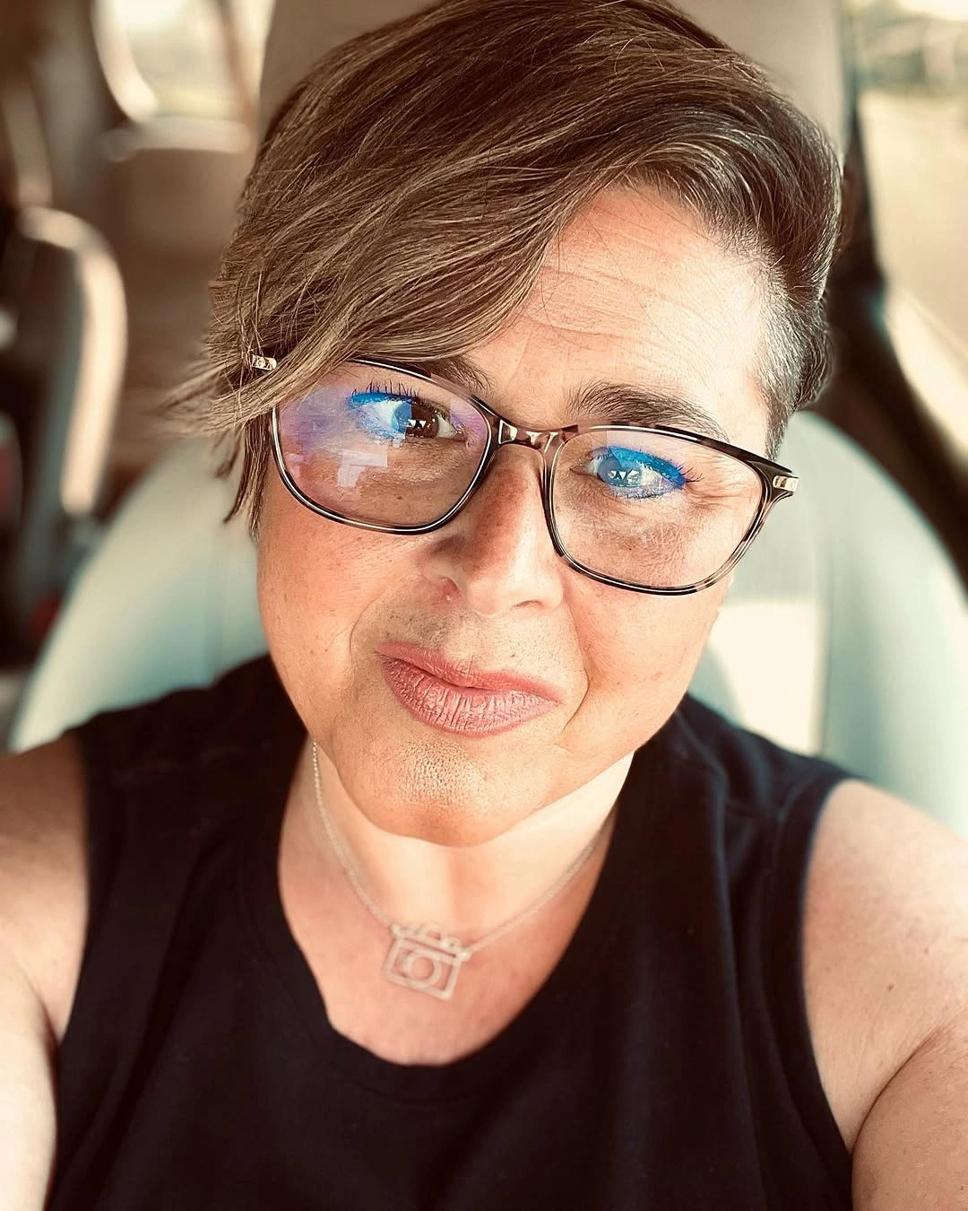Short brown pixie with cropped side and long swept top