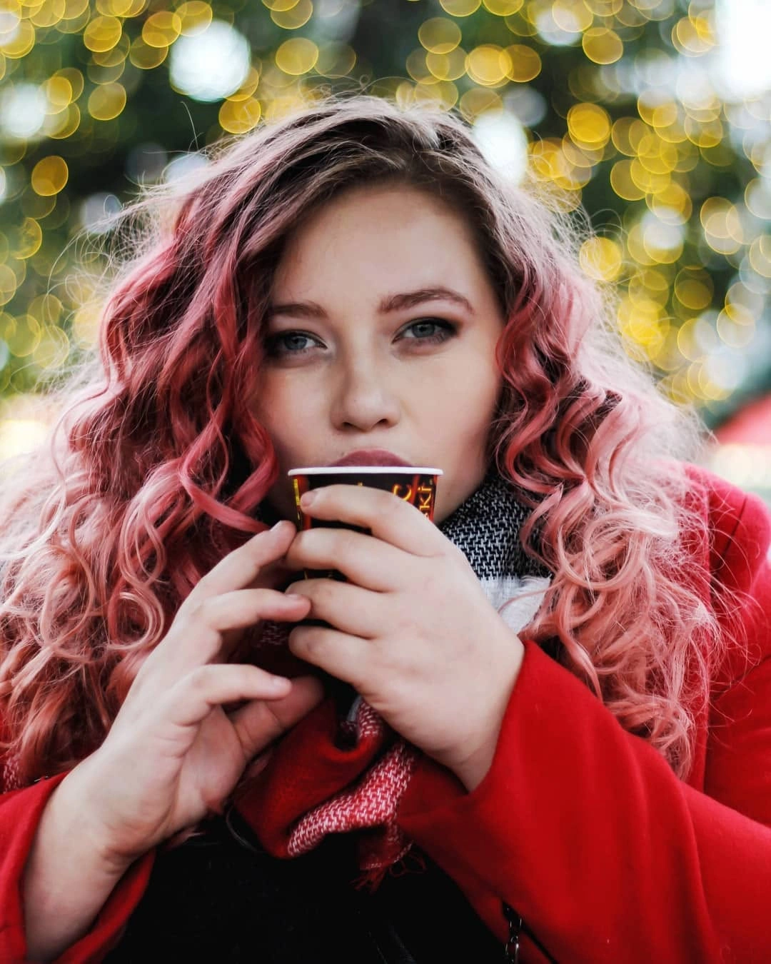 Long pink wavy hair with side part and paler ends