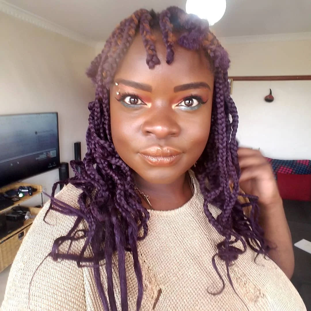 Purple braided or twist-like hair with shorter front sections