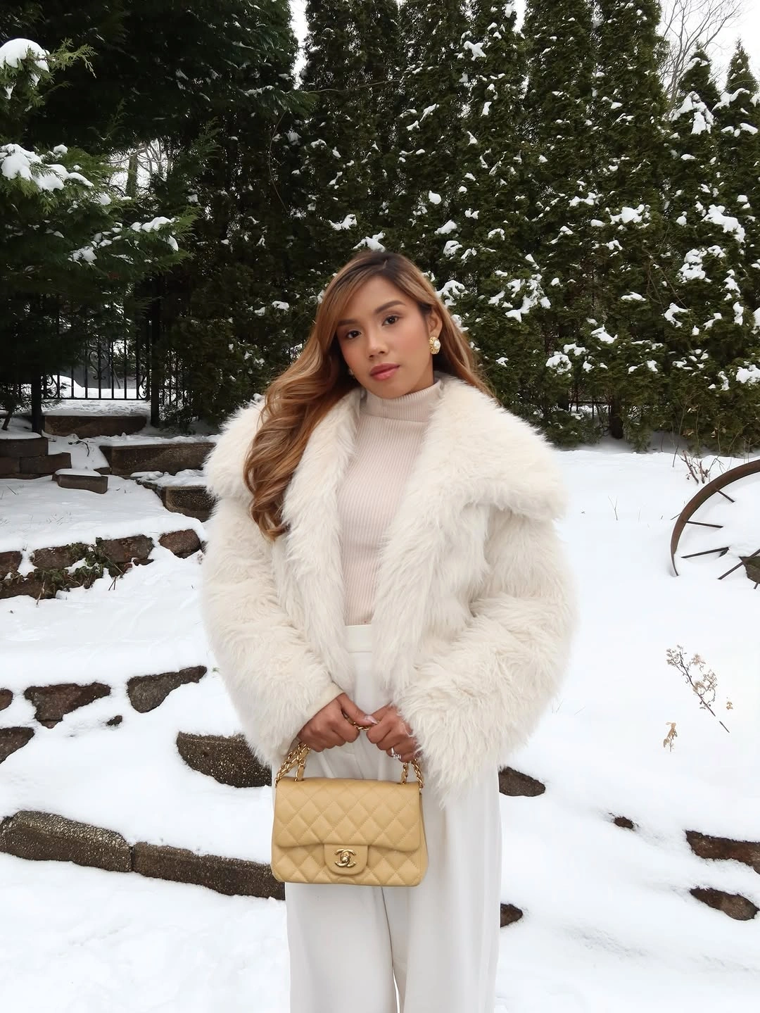 White fluffy cropped jacket with pale wide-leg trousers in snow