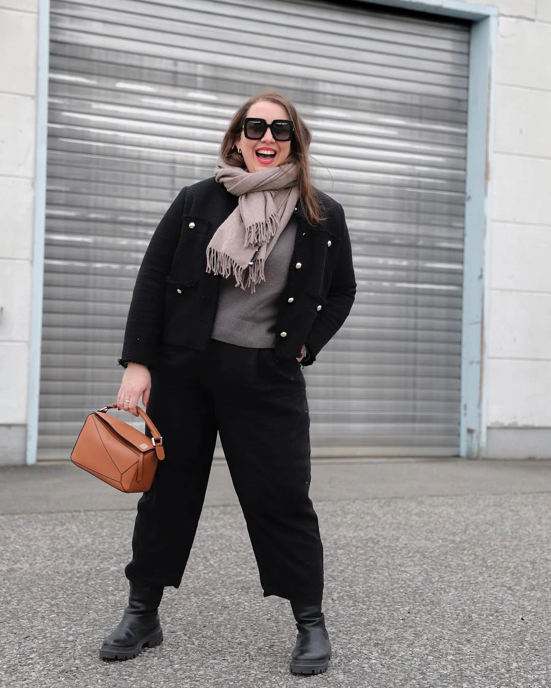 Black jacket, gray scarf, cropped wide pants, tan bag