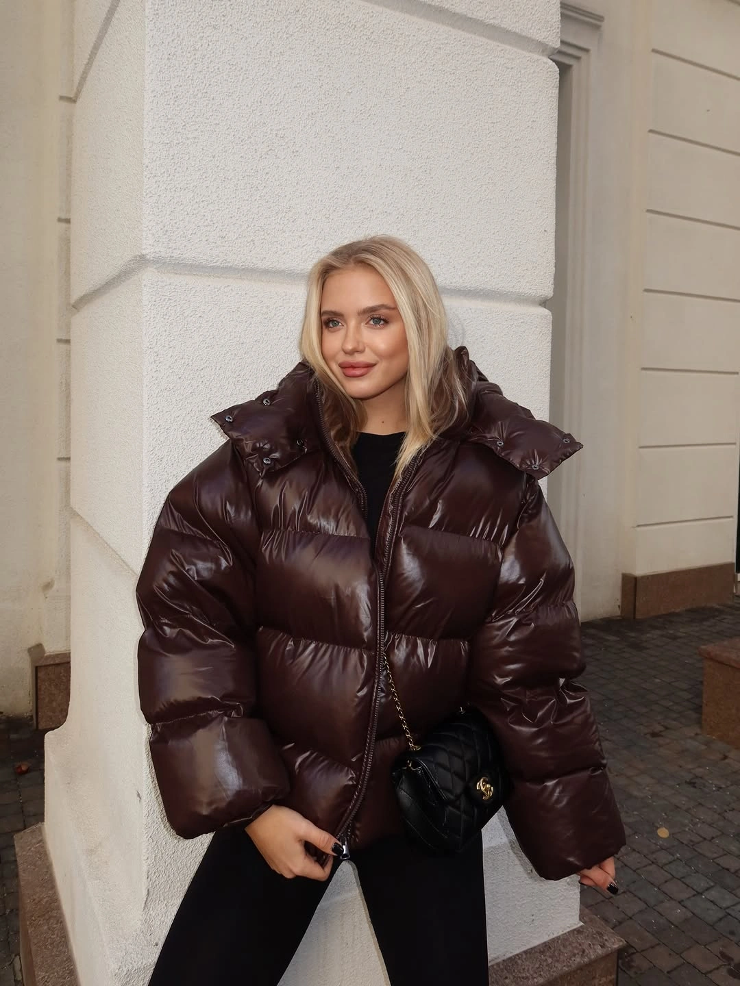Long tan coat with pale center layer and dark tights