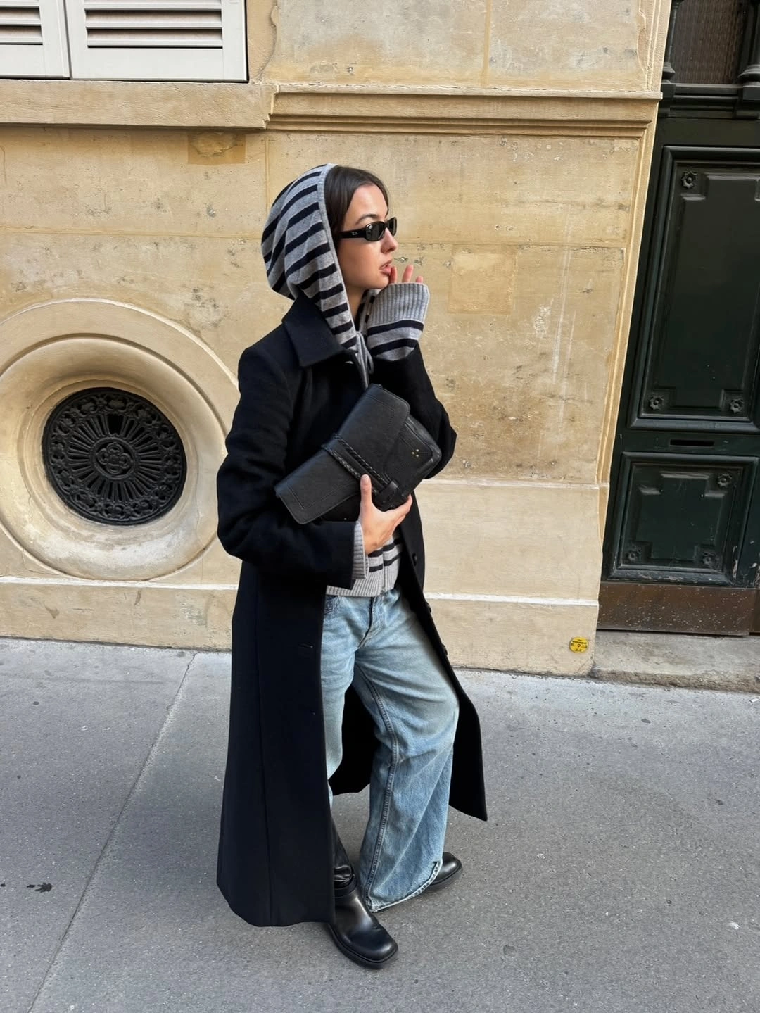 Glossy dark quilted-looking coat with shaggy black trim
