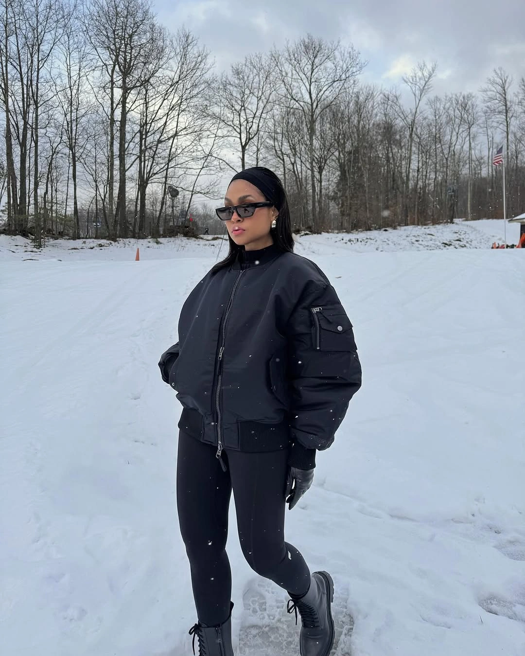 Black cropped bomber with fitted black trousers and dark boots