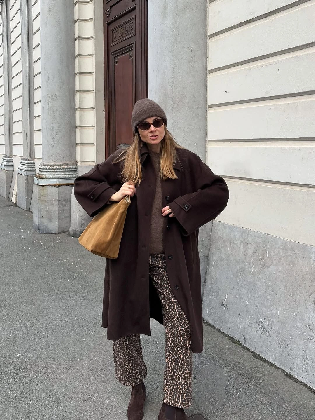 Brown long coat with patterned wide trousers and tan tote