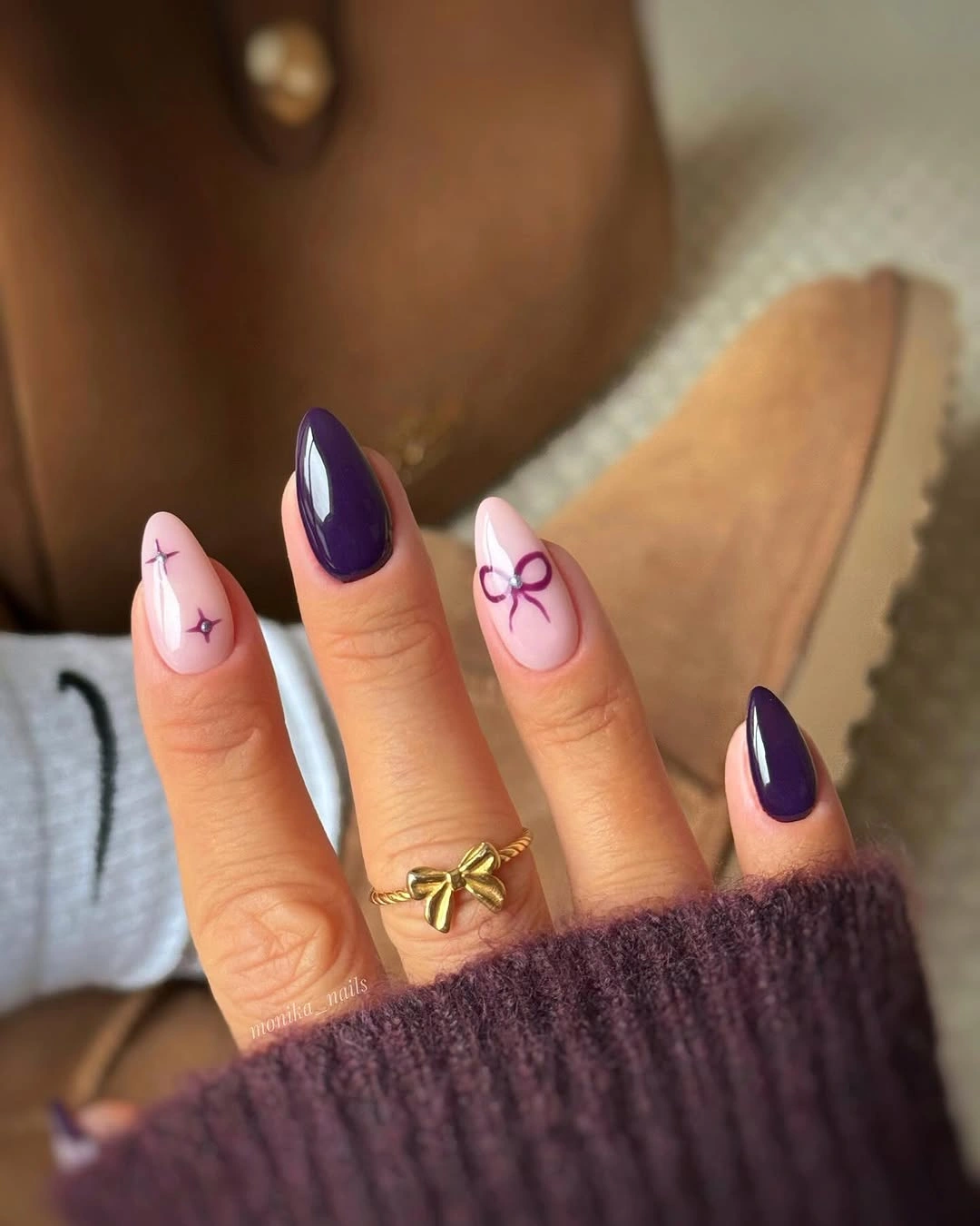Almond purple and pale pink nails with stars and bow art