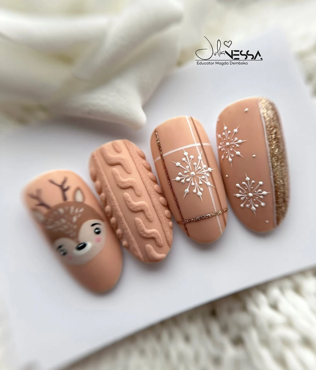 Display nail tips with reindeer, knit texture, snowflakes, and glitter