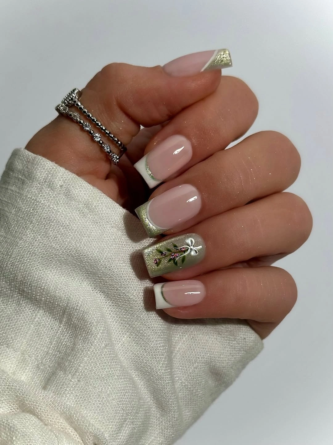 Square nude nails with white edges and muted glitter tips