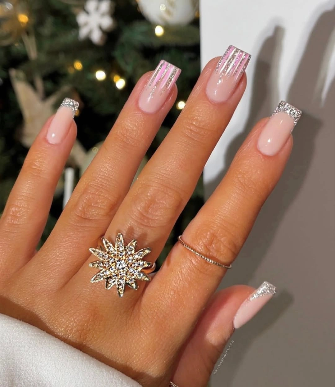 Long square pink nails with silver glitter tips and stripes