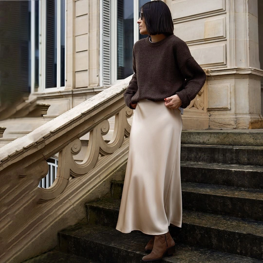 Dark brown sweater with cream satin-like long skirt