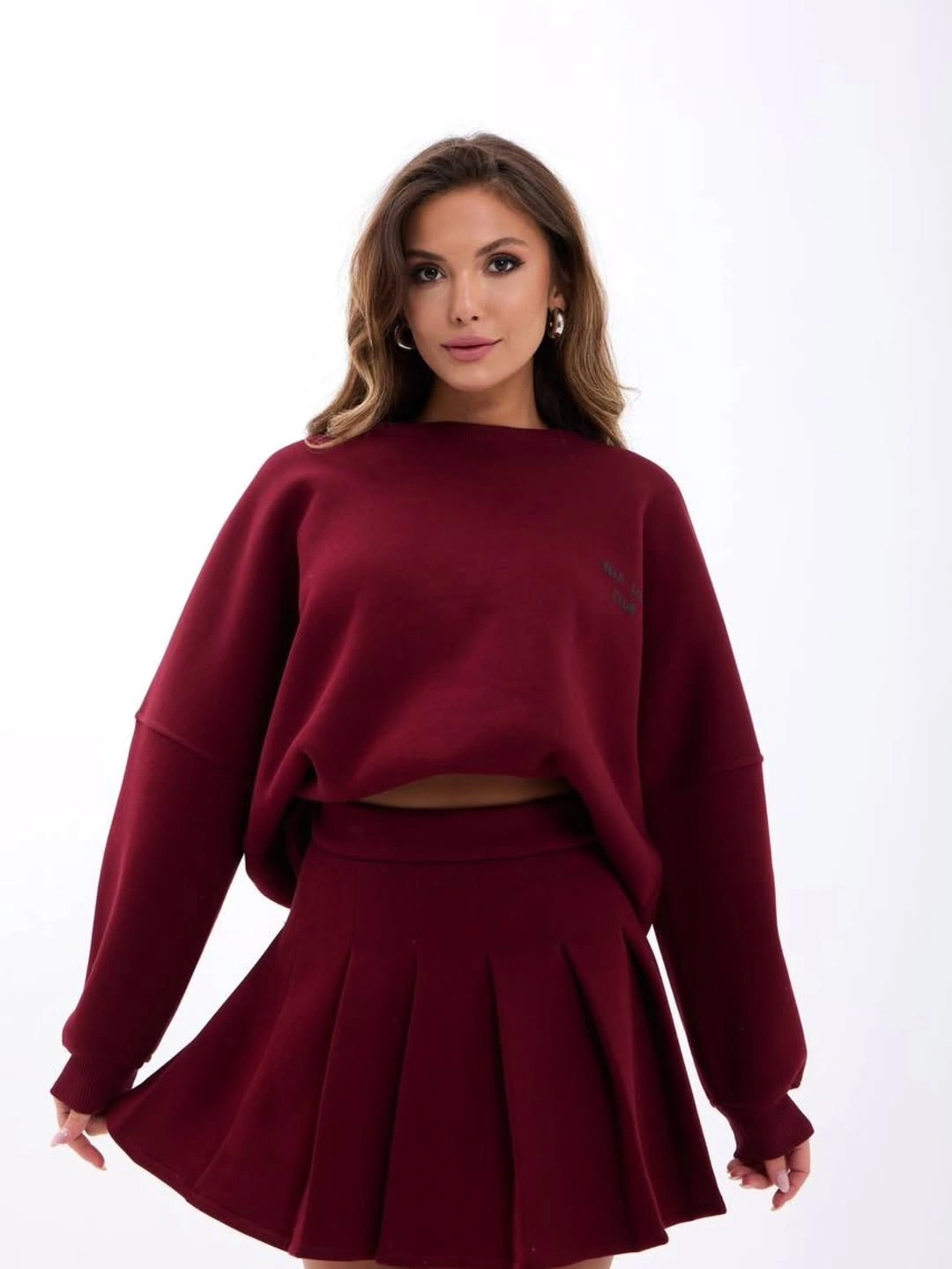 Burgundy sweatshirt with matching short pleated skirt
