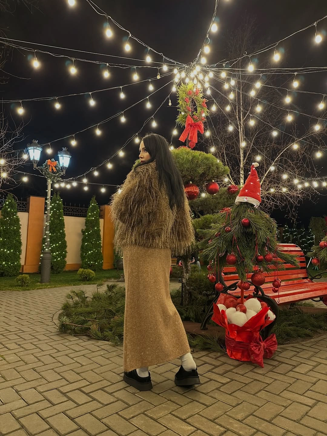 Shaggy brown coat with tan long skirt and black shoes