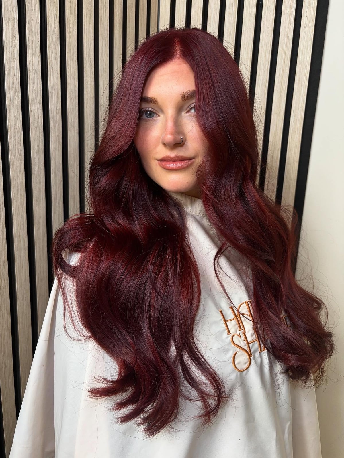 Deep Red Mid-Back Layers With Curtain Bangs Deep Red Mid-Back Layers With Curtain Bangs — Aesthetic Dye Hair