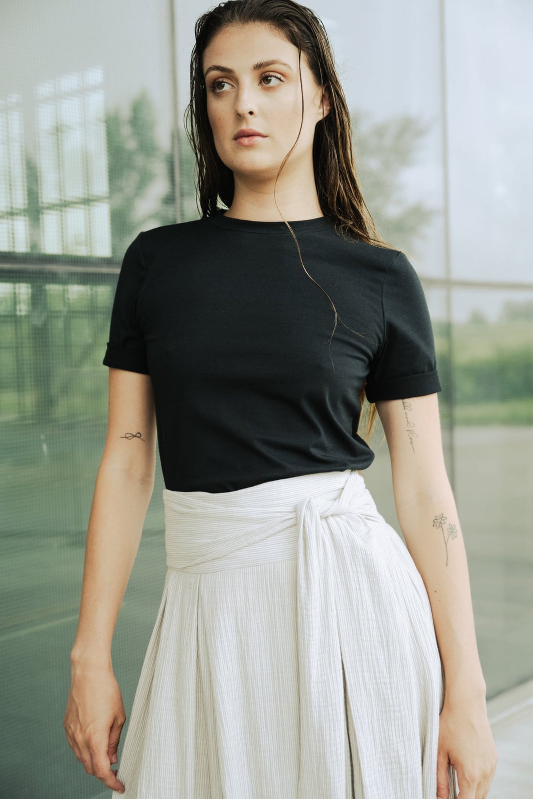 Black T-Shirt with White Sash Over a White Pleated Skirt Black T-Shirt with White Sash Over a White Pleated Skirt — Aesthetic Tshirt Outfit