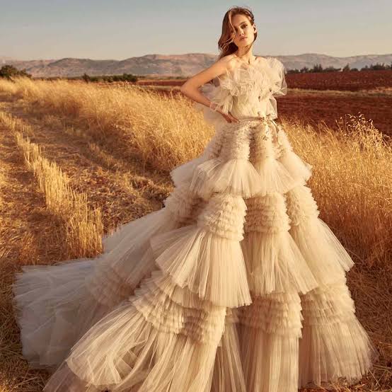 Ivory Tulle Ballgown Wedding Dress with Ruffled Skirt and Gold Belt Ivory Tulle Ballgown Wedding Dress with Ruffled Skirt and Gold Belt — Aesthetic Wedding Dress