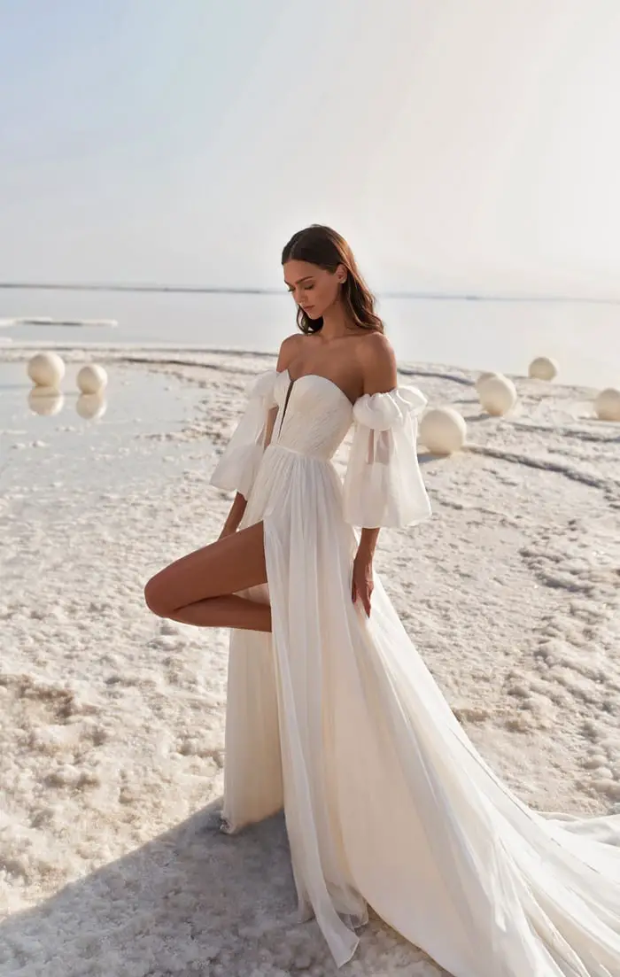 Ivory A-Line Wedding Dress with High Slit and Voluminous Sleeves Ivory A-Line Wedding Dress with High Slit and Voluminous Sleeves — Aesthetic Wedding Dress