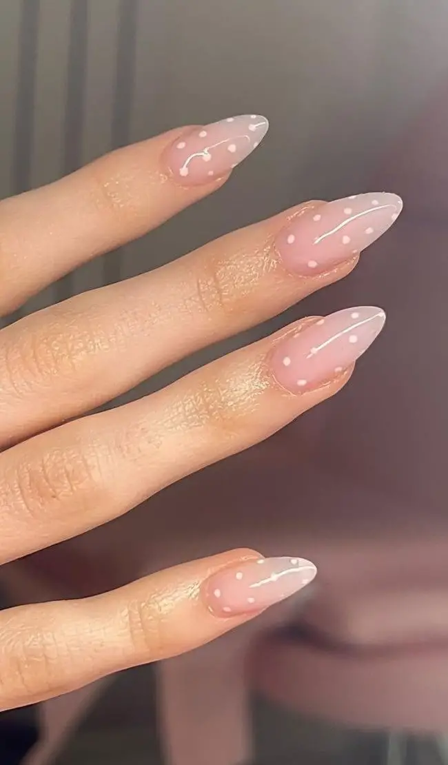 Short Almond Nails with White Polka Dots on Nude Base, Close-Up Take — Best Cute Almond Nails
