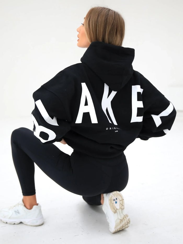 Oversized Black Hoodie with Graphic Text and Leggings — Chic Black Hoodie Outfit