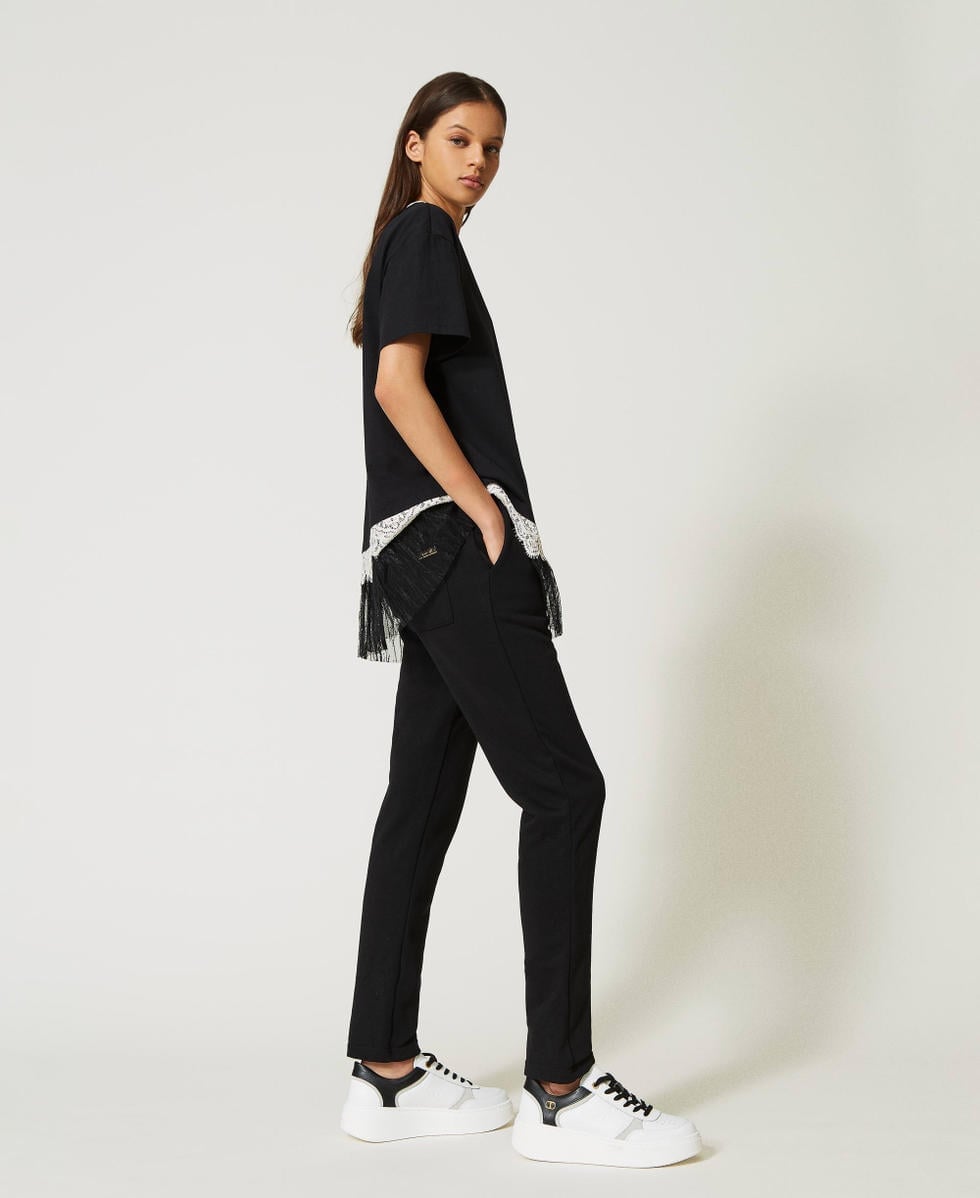 Straight-leg Sweatpants with a Black T-Shirt, Close-Up Take — Chic Black Sweatpants Outfit