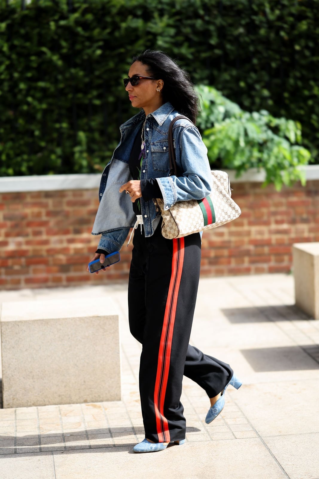 Black Sweatpants with Red Stripe Detail and a Denim Jacket — Chic Black Sweatpants Outfit