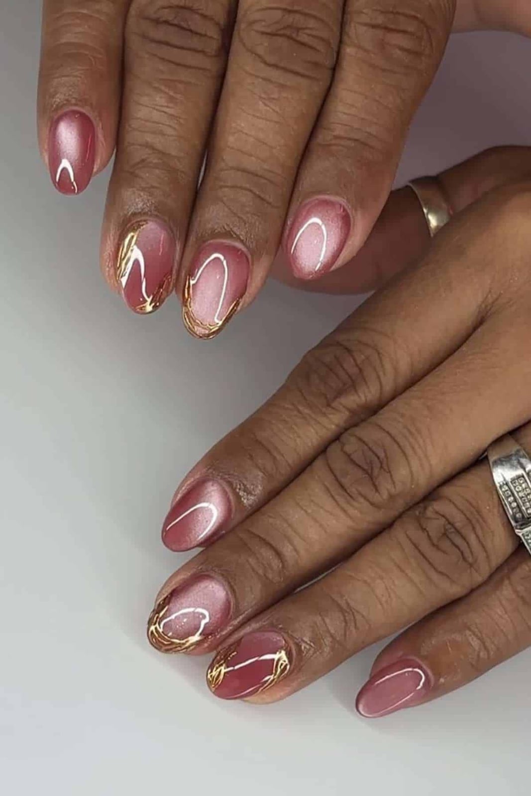 Medium Oval Nails With Shimmering Rose Gold And Pink Swirls — Classy Abstract Nails