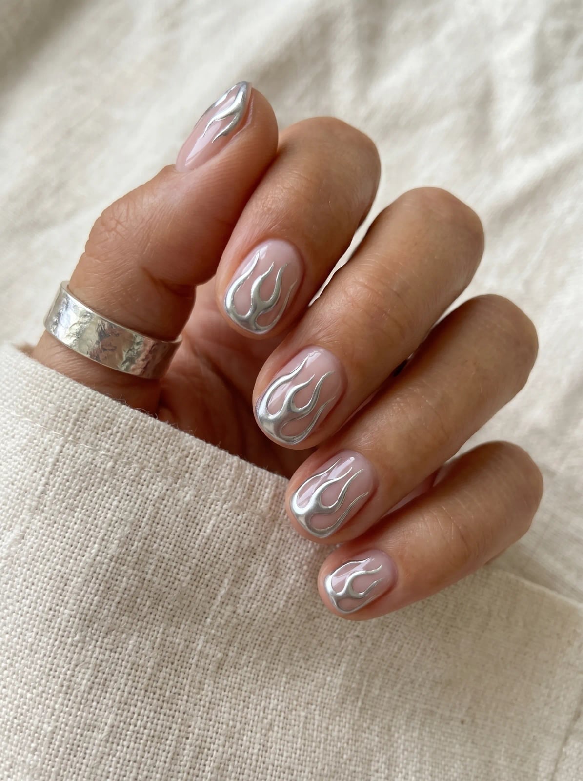 Short Oval Nails With Silver Flame Abstract Motifs — Classy Abstract Nails