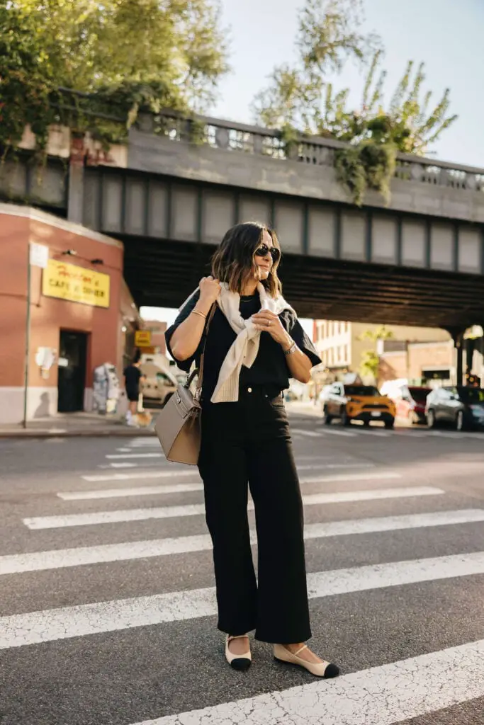 Black Wide Leg Jeans with a Cream Sweater Draped — Classy Black Jeans Outfits