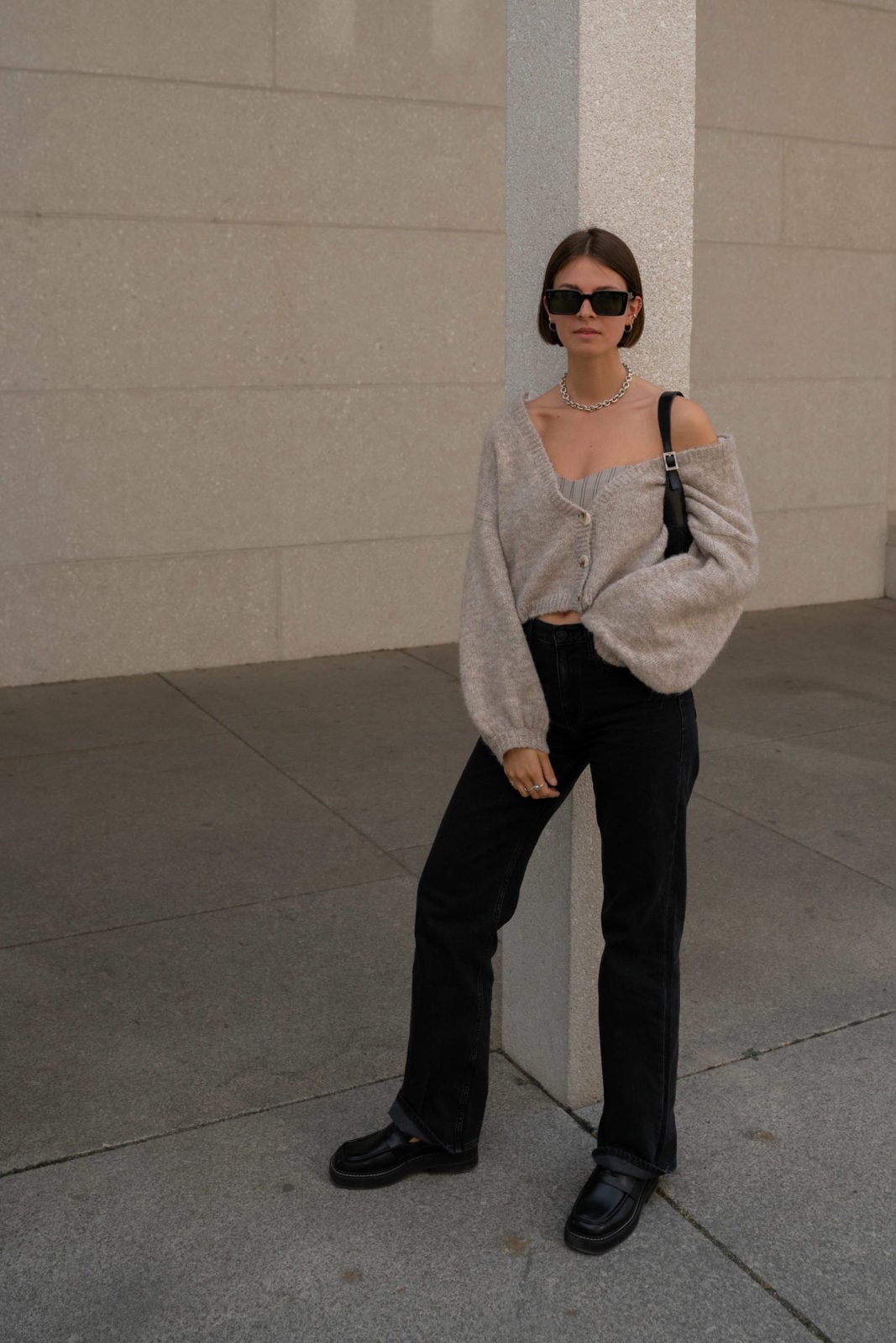 Black Loafers with Straight-Leg Jeans and an Off-Shoulder Cardigan — Classy Black Loafers Outfit
