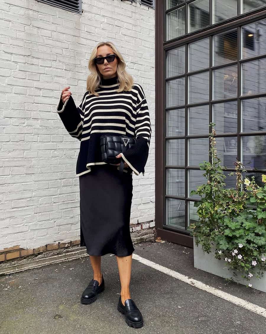 Black Loafers with a Satin Slip Skirt and Striped Sweater — Classy Black Loafers Outfit
