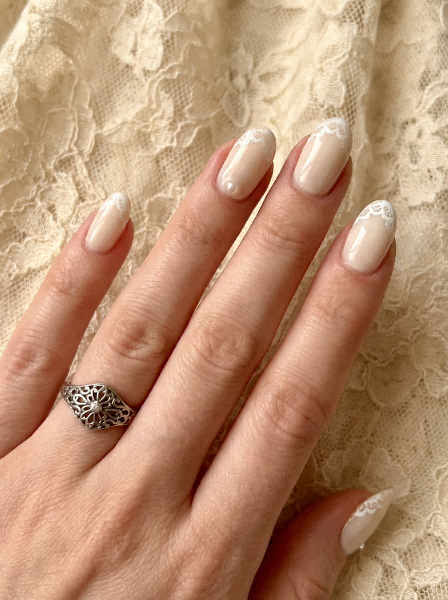 Short Almond Sheer Nude With White Lace Tips Short Almond Sheer Nude With White Lace Tips — Classy Boho Nails