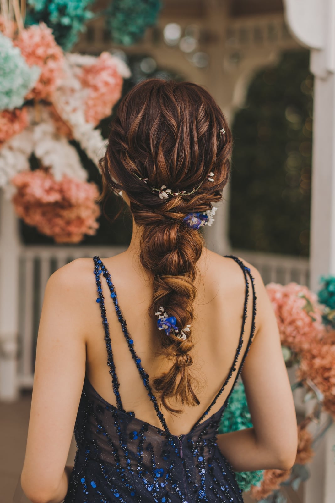 Dark Brown Braided Ponytail With Floral Pins Dark Brown Braided Ponytail With Floral Pins — Classy Bridal Hairstyles