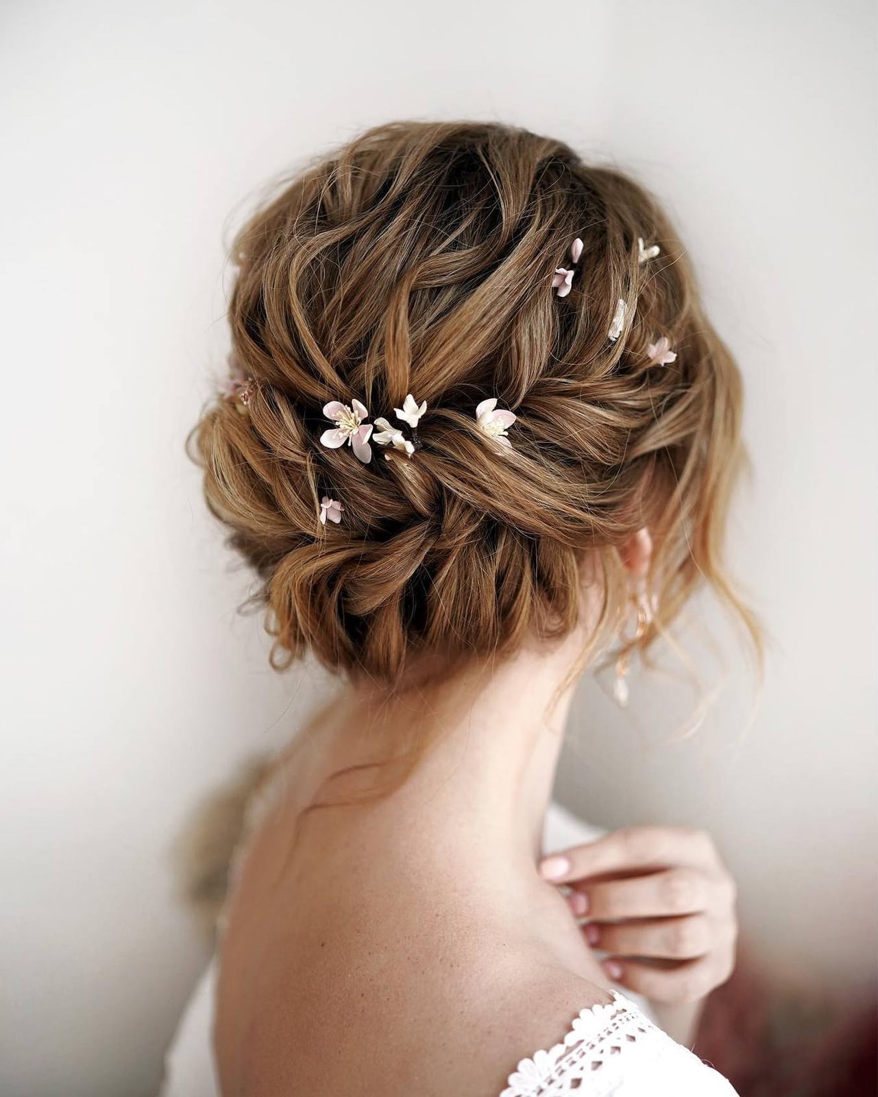 Warm Blonde Textured Updo With Flowers Warm Blonde Textured Updo With Flowers — Classy Bridesmaid Hair