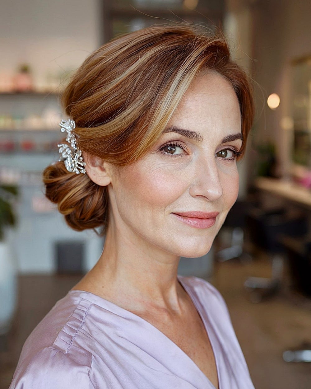 Auburn Loose Low Bun With Accessory Auburn Loose Low Bun With Accessory — Classy Bridesmaid Hair