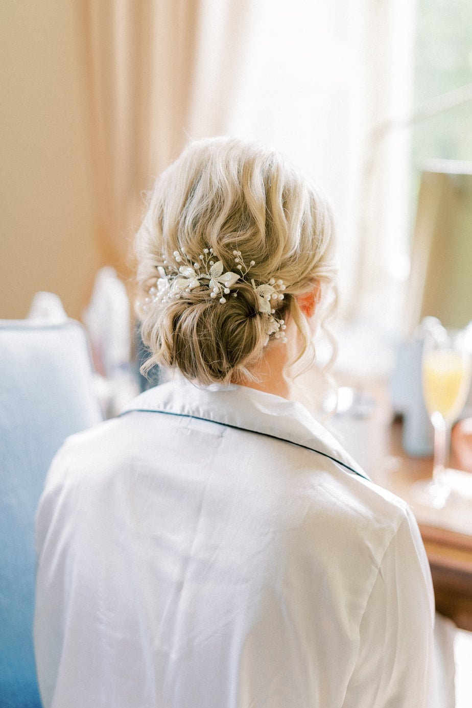 Elegant Blonde Low Bun With Twists and Pearls — Classy Bridesmaid Hair Updo