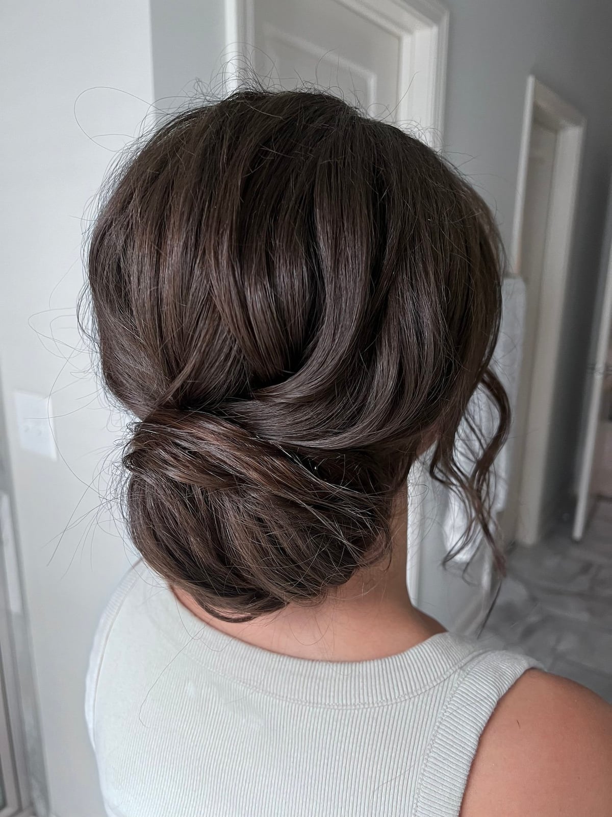 Textured Dark Brown Low Bun With Braids — Classy Bridesmaid Hair Updo