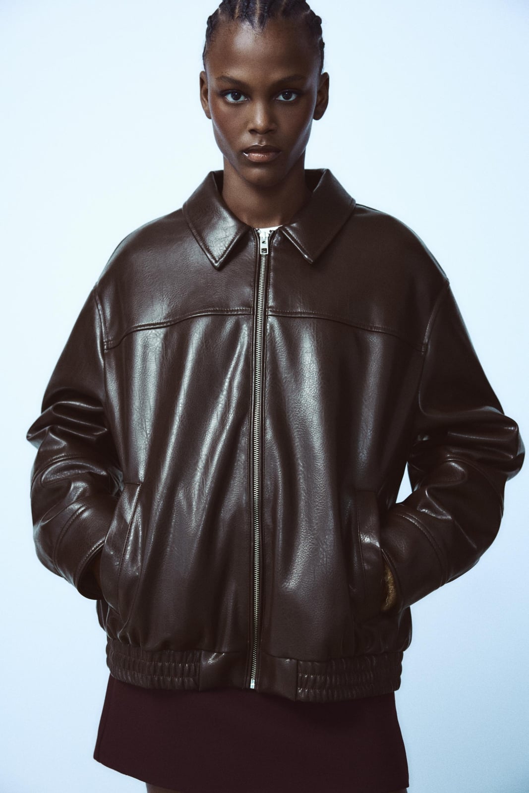 Oversized Brown Leather Bomber Jacket with White Top, Close-Up Take Oversized Brown Leather Bomber Jacket with White Top, Close-Up Take — Classy Brown Leather Jacket Outfit