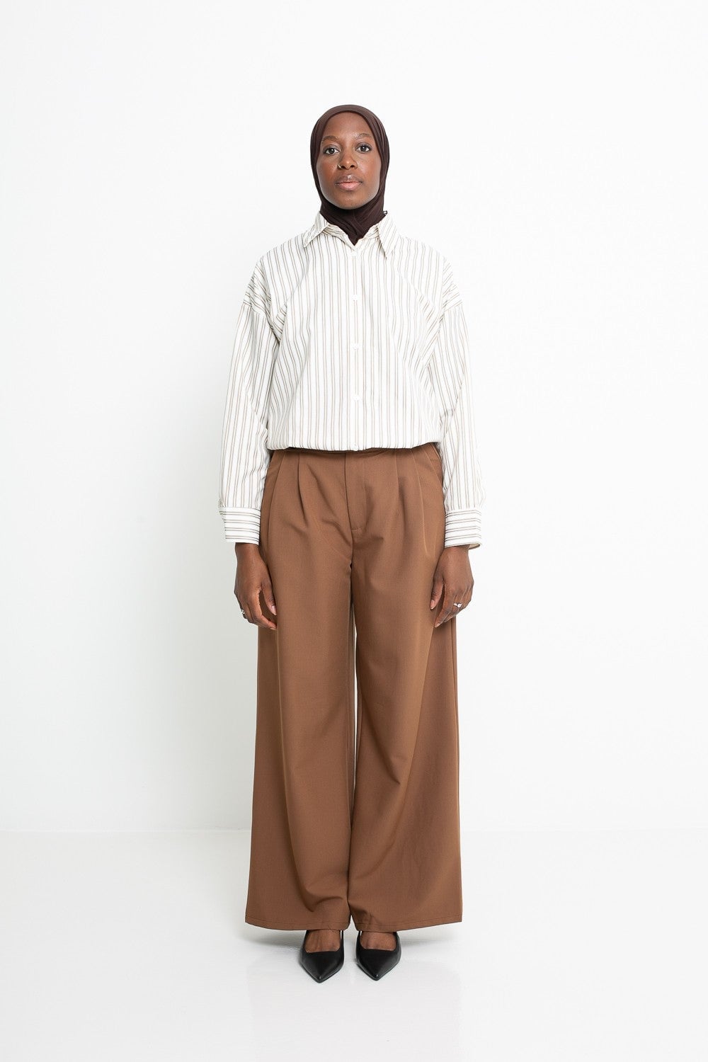 Brown Pleated Wide-Leg Trousers with Striped Shirt, Close-Up Take — Classy Brown Pants Outfits