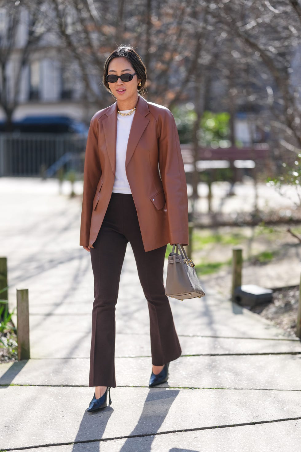 Brown Flare-Leg Trousers with a White T-Shirt and Leather Blazer Brown Flare-Leg Trousers with a White T-Shirt and Leather Blazer — Classy Brown Trousers Outfit