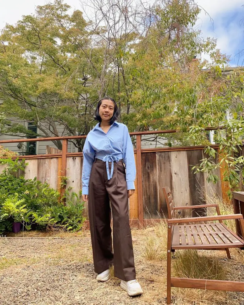 Brown Wide-Leg Trousers with a Blue Button-Up Shirt Tied at the Waist Brown Wide-Leg Trousers with a Blue Button-Up Shirt Tied at the Waist — Classy Brown Trousers Outfit