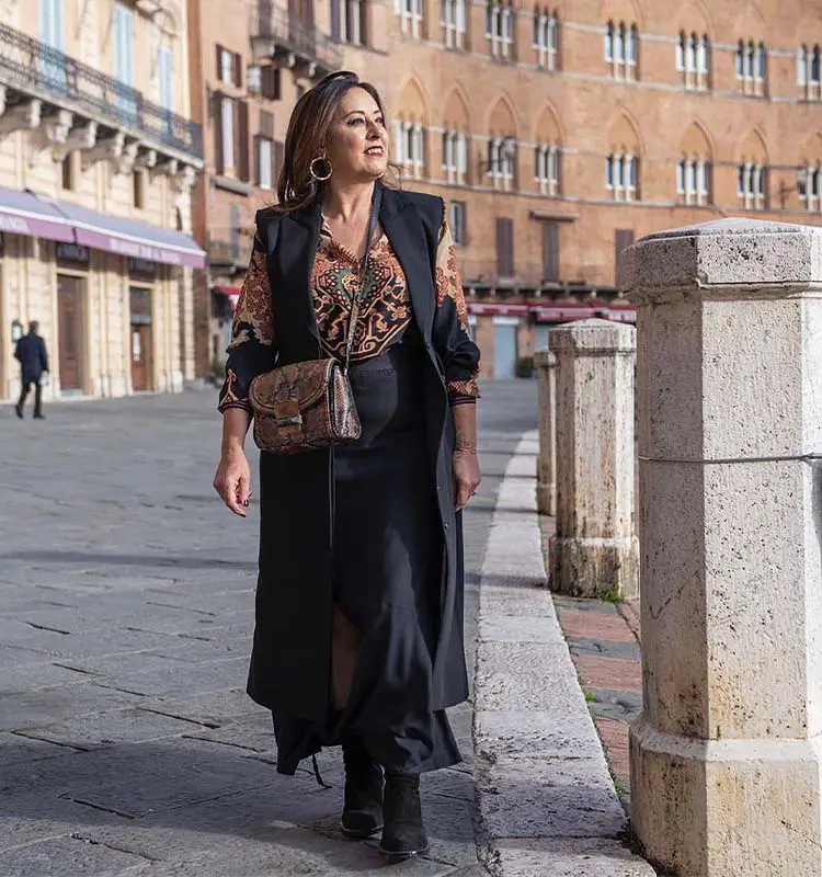 Black Longline Vest Layers Over Patterned Blouse and Midi Skirt Black Longline Vest Layers Over Patterned Blouse and Midi Skirt — Classy Capsule Wardrobe