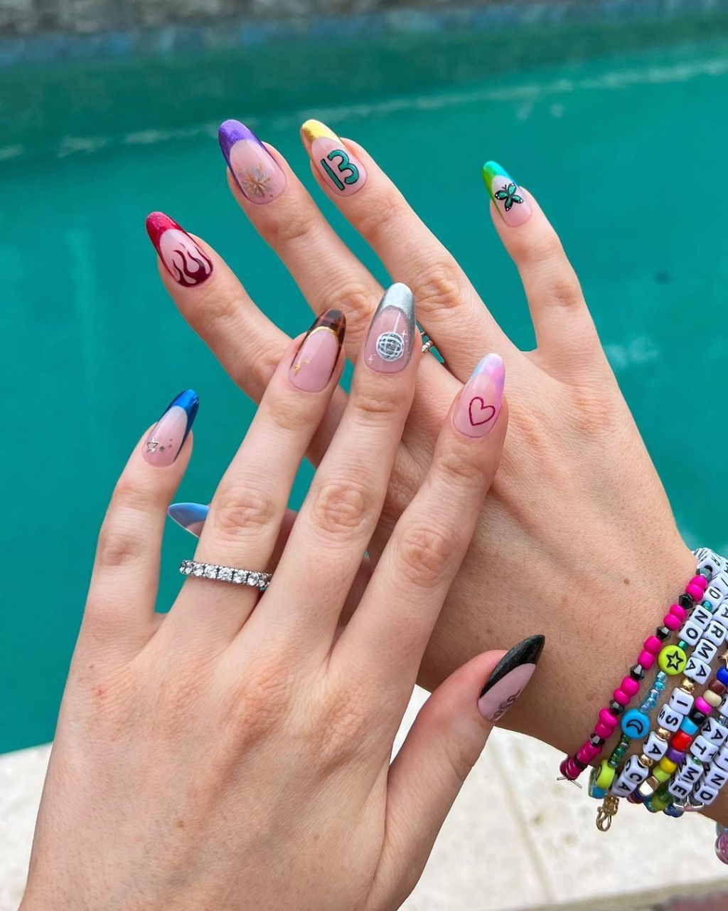 Long Almond Multi-Colored French With Motifs Nails Long Almond Multi-Colored French With Motifs Nails — Classy Concert Nails