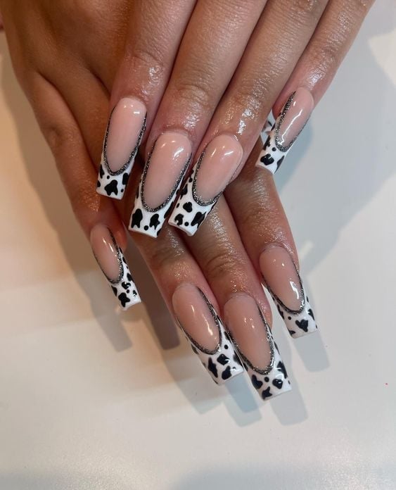 Long Coffin Nude with Cow Print and Glitter French, Close-Up Take Long Coffin Nude with Cow Print and Glitter French, Close-Up Take — Classy Cow Print Nails