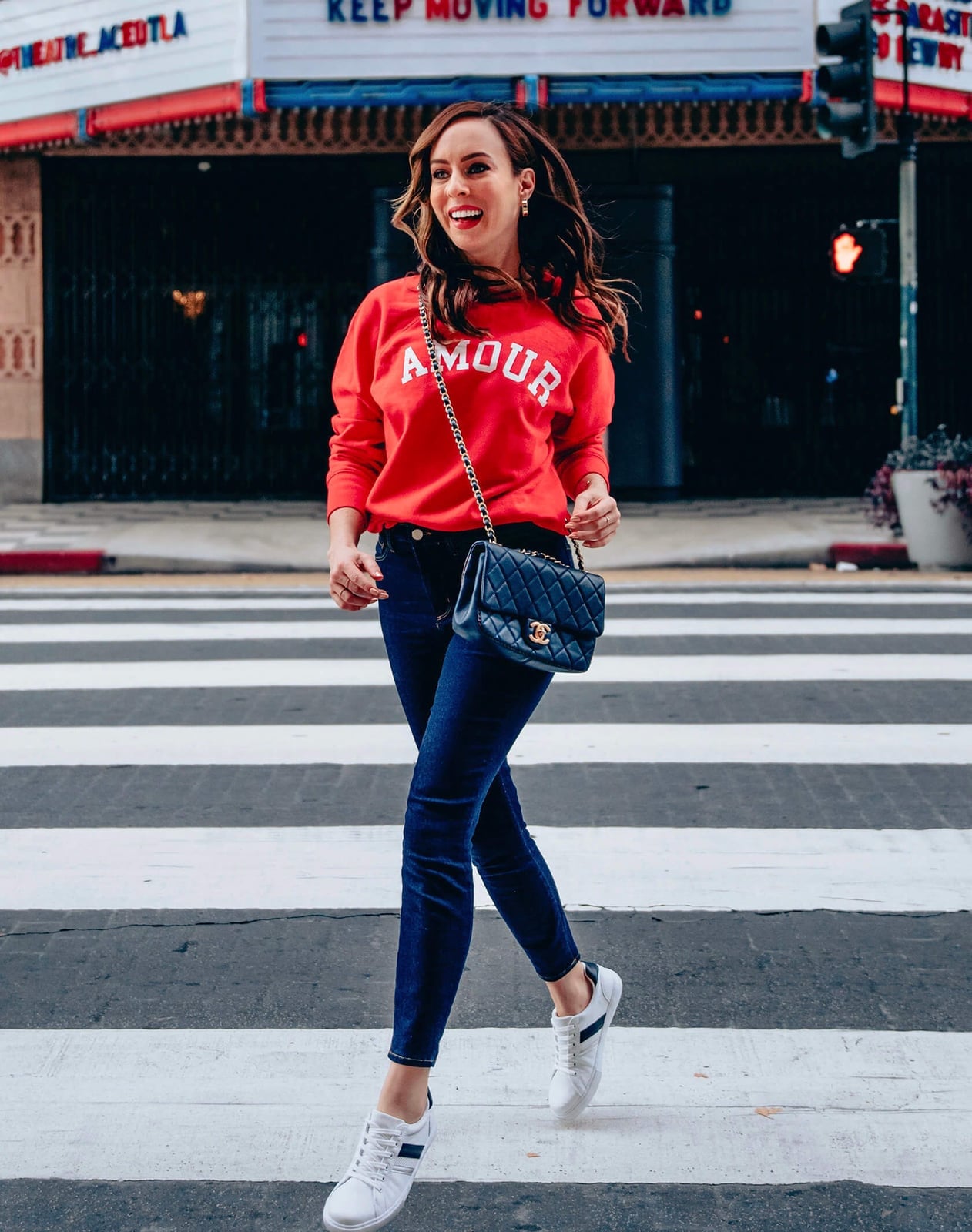 Red 'Amour' Sweatshirt with Dark Blue Skinny Jeans and White Sneakers — Classy Crewneck Outfits