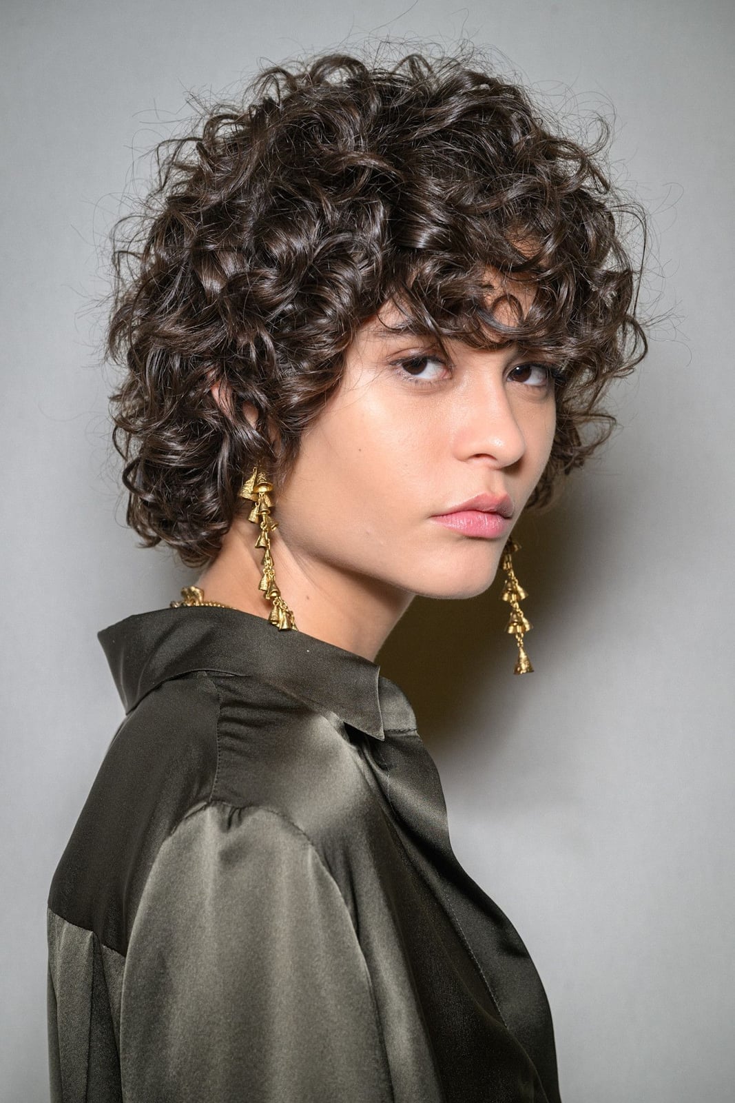 Short Bob With Wispy Bangs And Defined Curls Short Bob With Wispy Bangs And Defined Curls — Classy Curly Hair Cutting